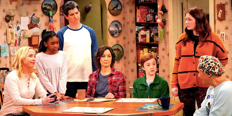 The Conner family sit at the kitchen table staring at Estelle Parsons' Beverly in The Conners season 2