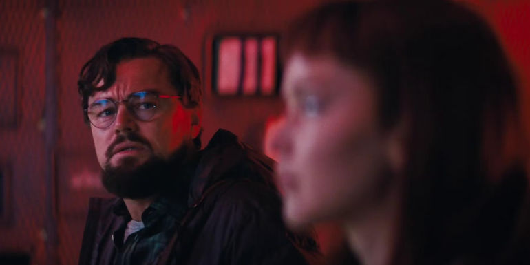 Leonardo DiCaprio and Jennifer Lawrence in red light in Don't Look Up