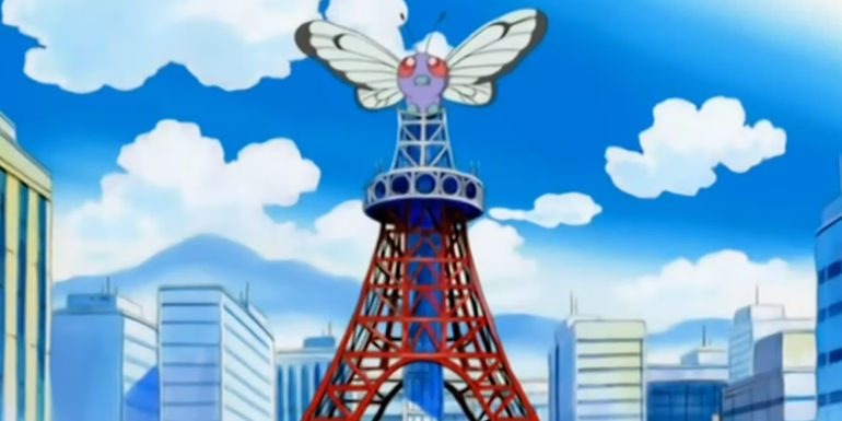 Pokemon: Giant Butterfree atop a destroyed tower.
