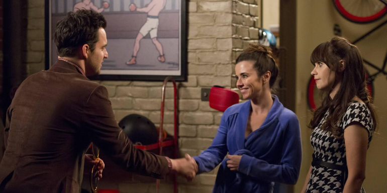 Nick shaking Abby's hand as Jess stands nearby in New Girl