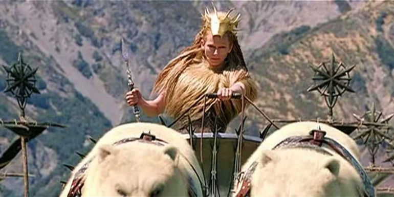 Jadis the White Witch riding on her chariot pulled by polar bears. 