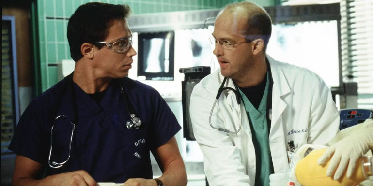 Erik Palladino and Anthony Edwards in a scene in front of x-rays in ER