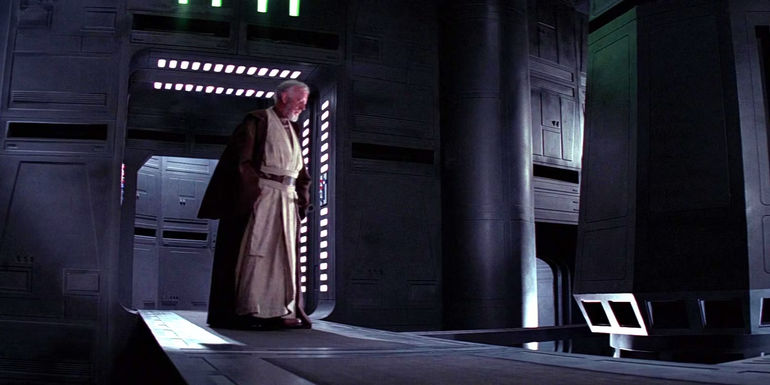 Obi-Wan Kenobi (Alec Guinness) stares over the ledge of a huge fall while searching for the tractor beam on the Death Star in the original Star Wars
