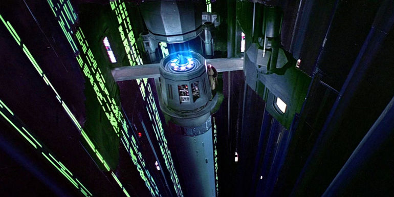 Obi-Wan Kenobi (Alec Guinness) makes his way across a narrow and steep ledge to reach the tractor beam on the Death Star in the original Star Wars