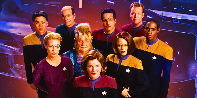 The cast of Star Trek: Voyager stands together looking at the camera with the USS Voyager in the background.