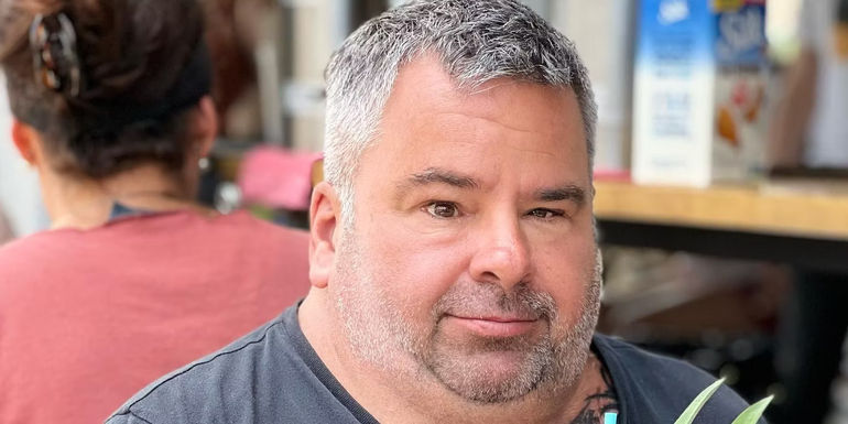 Big Ed Brown from 90 Day Fiancé smiling with silver fox look