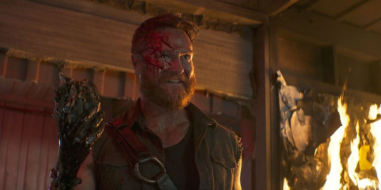 Kano holds a heart in Mortal Kombat