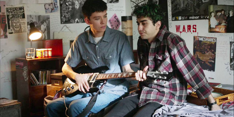 Asa Butterfield playing bass