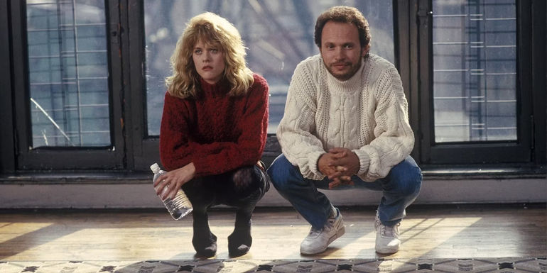Meg Ryan and Billy Crystal crouching together in When Harry Met Sally