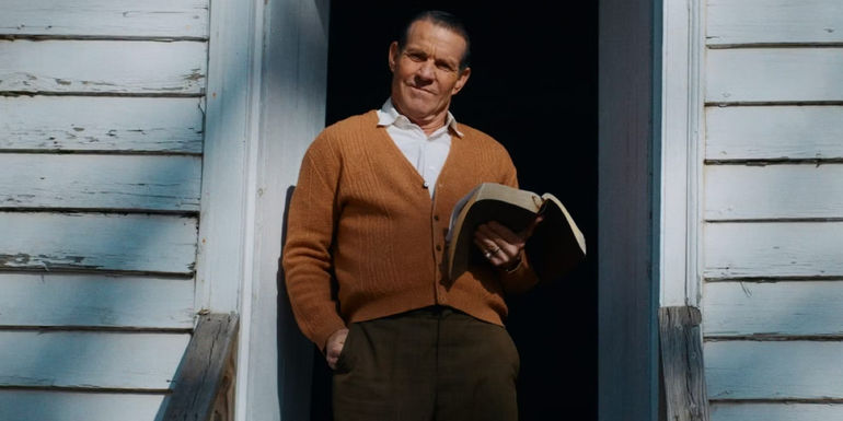 Dennis Quaid standing in the doorway with a bible in The Hill