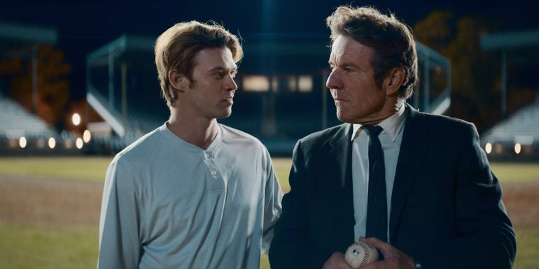Colin Ford and Denis Quaid walking on the baseball field in The Hill