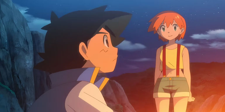 A girl with orange hair smiles down at a boy with black hair.
