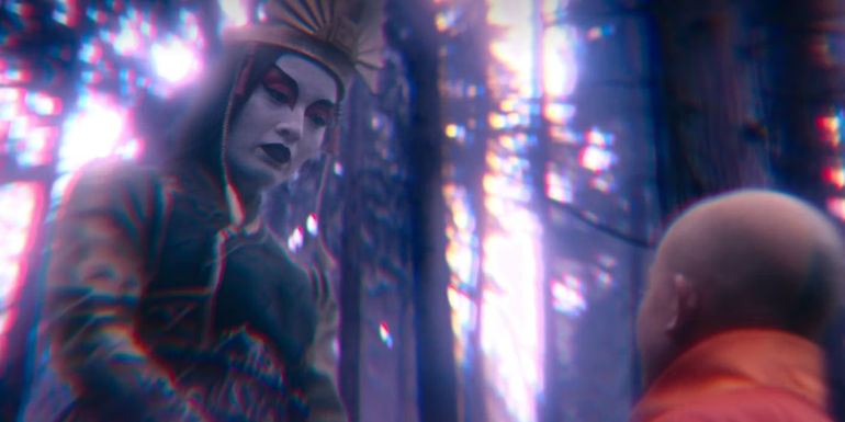 Kyoshi looking down at Aang in a vision