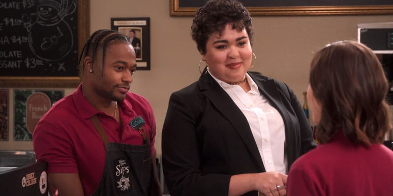 Lila and Canaan stand side by side while smiling in The Sex Lives Of College Girls season 2