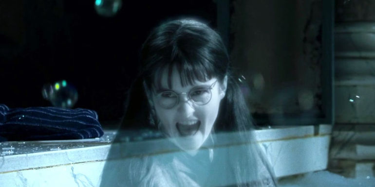 Moaning Myrtle cackling in the bath in Harry Potter and the Goblet of Fire - Plothole In Harry Potter & The Chamber of Secrets - The Teachers Would Have Asked Moaning Myrtle How She Died