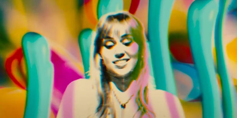 Miley Cyrus in Drive-Away Dolls - Drive-Away Dolls' Psychedelic Scenes Are Perfect Callbacks To The Big Lebowski