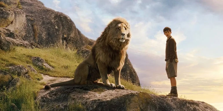 Edmund and Aslan stand on a rock in The Chronicles of Narnia.  - Netflix Acquired The Rights In 2018 - The Chronicles Of Narnia Is Confirmed