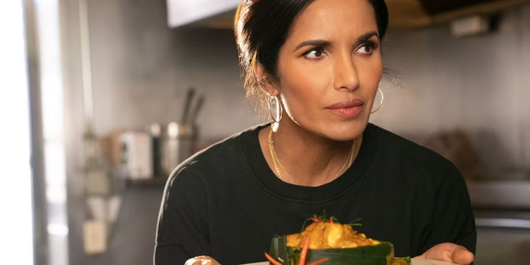 Padma Lakshmi holding a dish of food in Taste the Nation - Top Chef Season 5 - New York