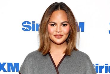 Chrissy Teigen's Airport Adventure: Finding Rest Amid Delays