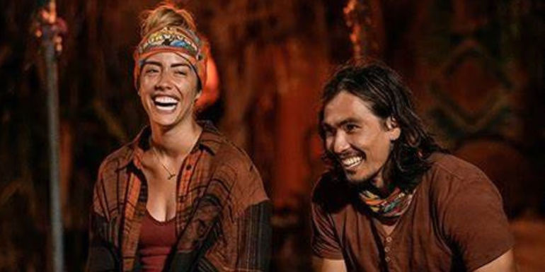Dee and Austin tribal council Survivor smiling at tribal council