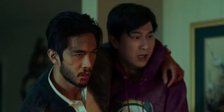 Charles (Justin Chen) and Bruce (Sam Li) holding each other in The Brothers Sun