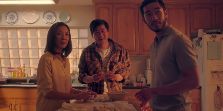 Charles (Justin Chen), Bruce (Sam Li), and Mama (Michelle Yeoh) baking in The Brothers Sun