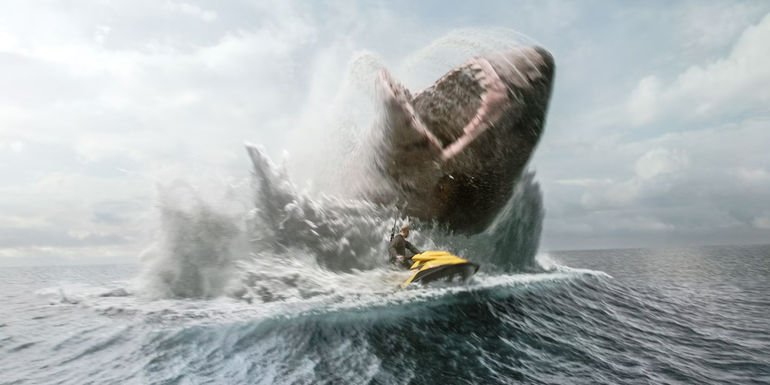 Jonas rides away from a meg on a jet ski in Meg 2 The Trench