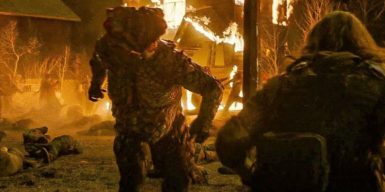 A bloater attacks Perry in The Last of Us