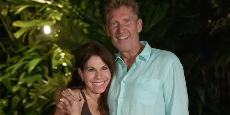 Gerry Turner from The Golden Bachelor with his arm around his fiance Theresa Nist, both smiling
