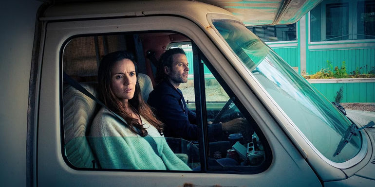 Jim and Tabitha in a truck in From.