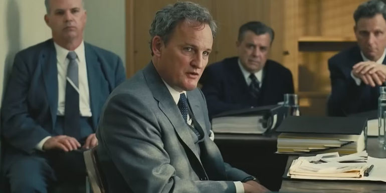 Jason Clarke in a hearing room in Oppenheimer