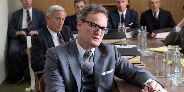 Jason Clarke as Roger Robb sitting in a security hearing in Oppenheimer