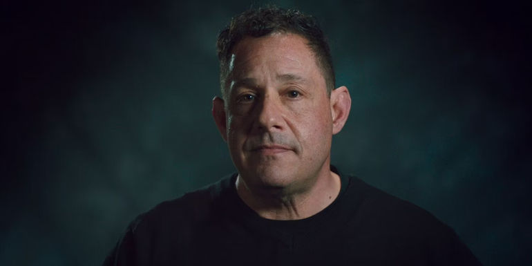 David Kellman talking to the camera in Three Identical Strangers