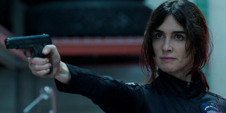 Paz Vega points a gun in Kaleidoscope