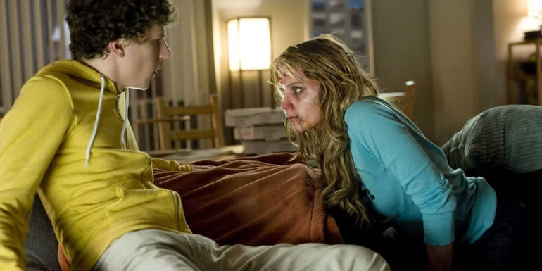 Columbus (Jessie Eisenberg) backing away from zombie 406 (Amber Heard) in Zombieland