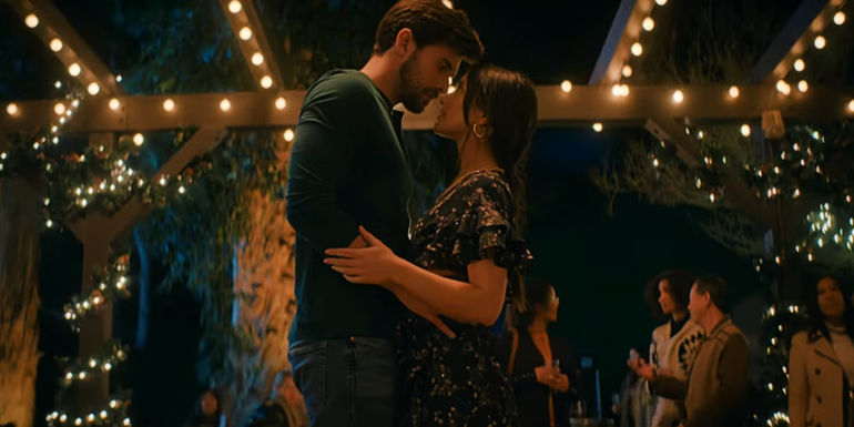 Carter and Valentina Dance under white christmas lights in Holiday in the Vineyards.