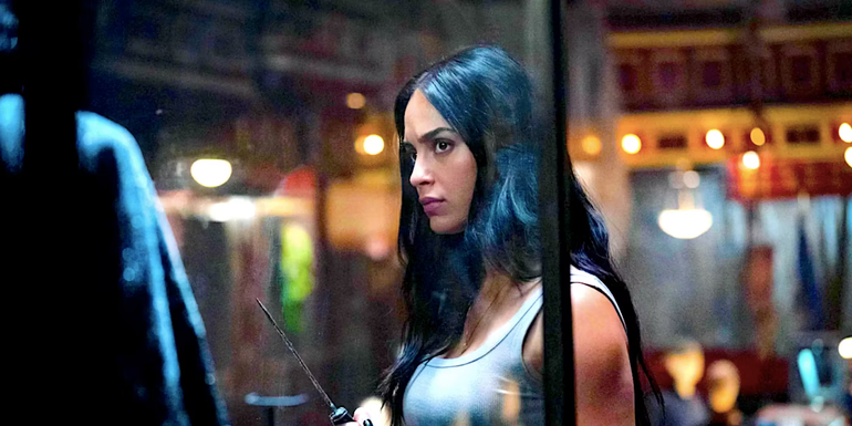 Sam eyes up the Ghostface shrine in Scream VI