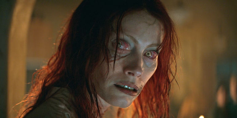 Ellie (Alyssa Sutherland) looks angrily over her shoulder as a possessed Deadite in Evil Dead Rise
