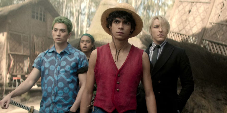 Mackenyu as Zoro, Jacob Gibson as Usopp, Inaki Godoy as Luffy, and Taz Skylar as Sanji walk through Coco village in Netflix's live-action One Piece