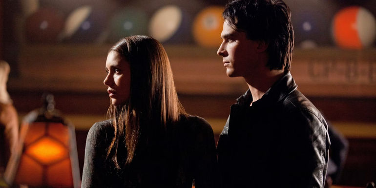 Elena and Damon standing together in the Grille in The Vampire Diaries episode The New Deal