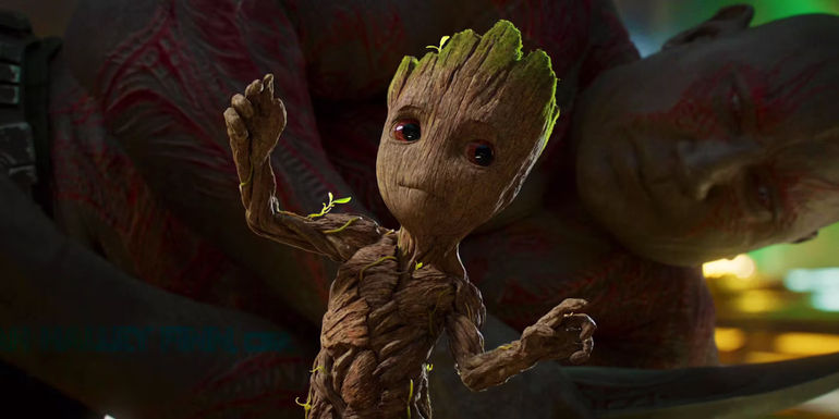 Baby Groot frozen with Drax looking at him in Guardians of the Galaxy Vol. 2