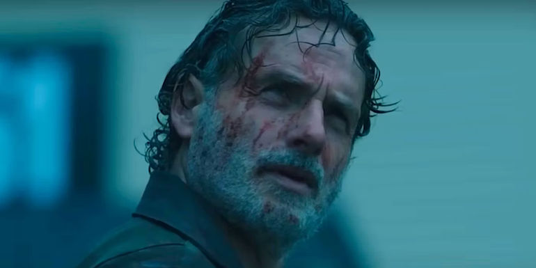 Andrew Lincoln as Rick Grimes covered in blood looking up in The Walking Dead The Ones Who Live