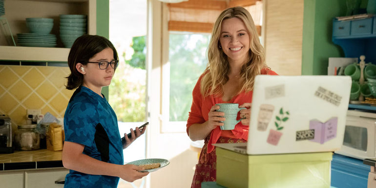 Wesley Kimmel and Reese Witherspoon in Your Place or Mine looking at a laptop screen