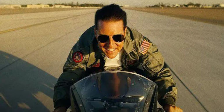 Tom Cruise as Pete Mitchell riding a motorcycle in Top Gun: Maverick