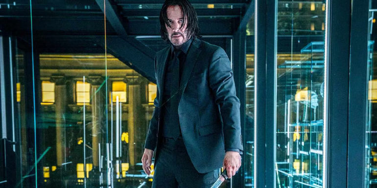 Keanu Reeves holding a samurai sword in John Wick