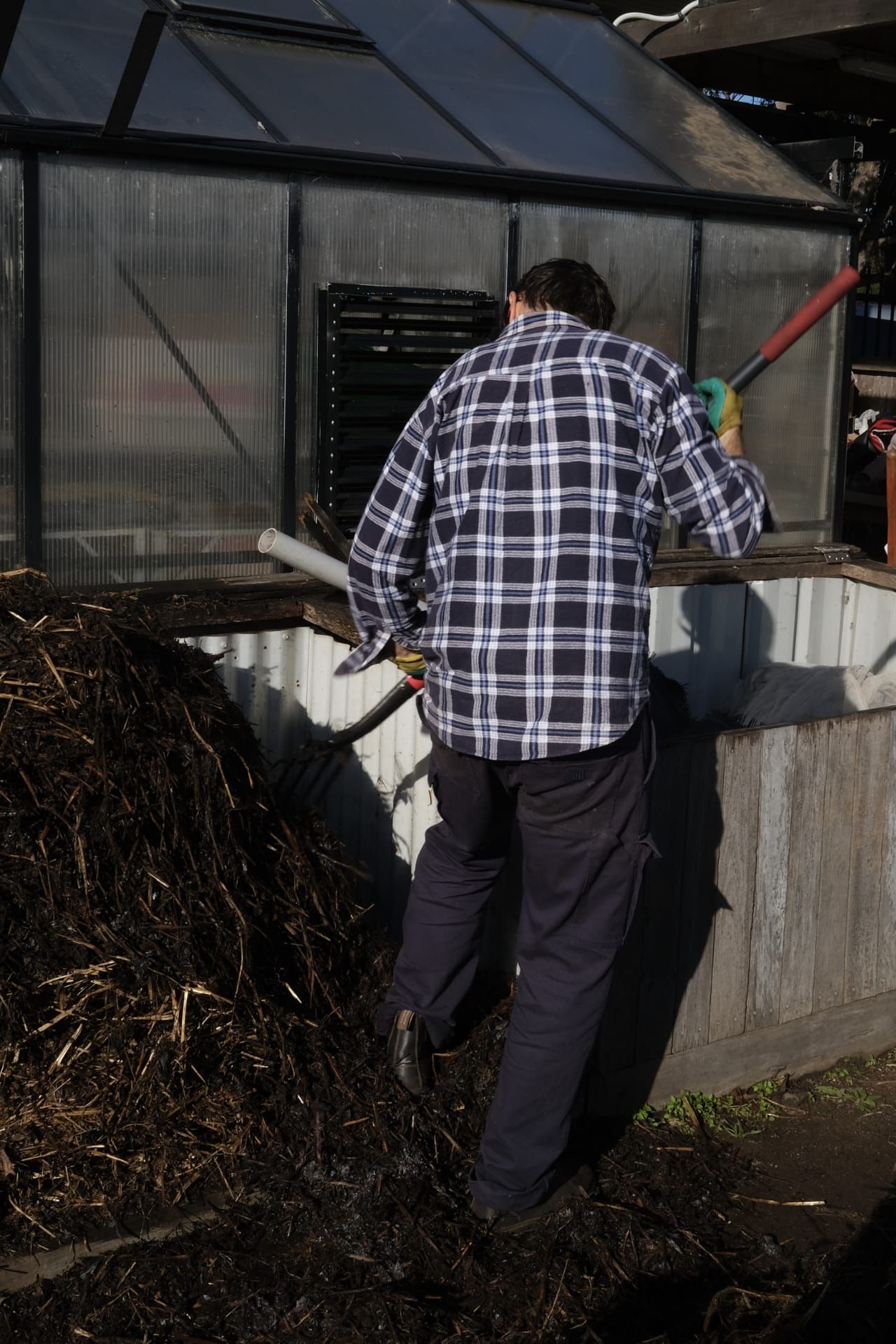 Ben turning the compost