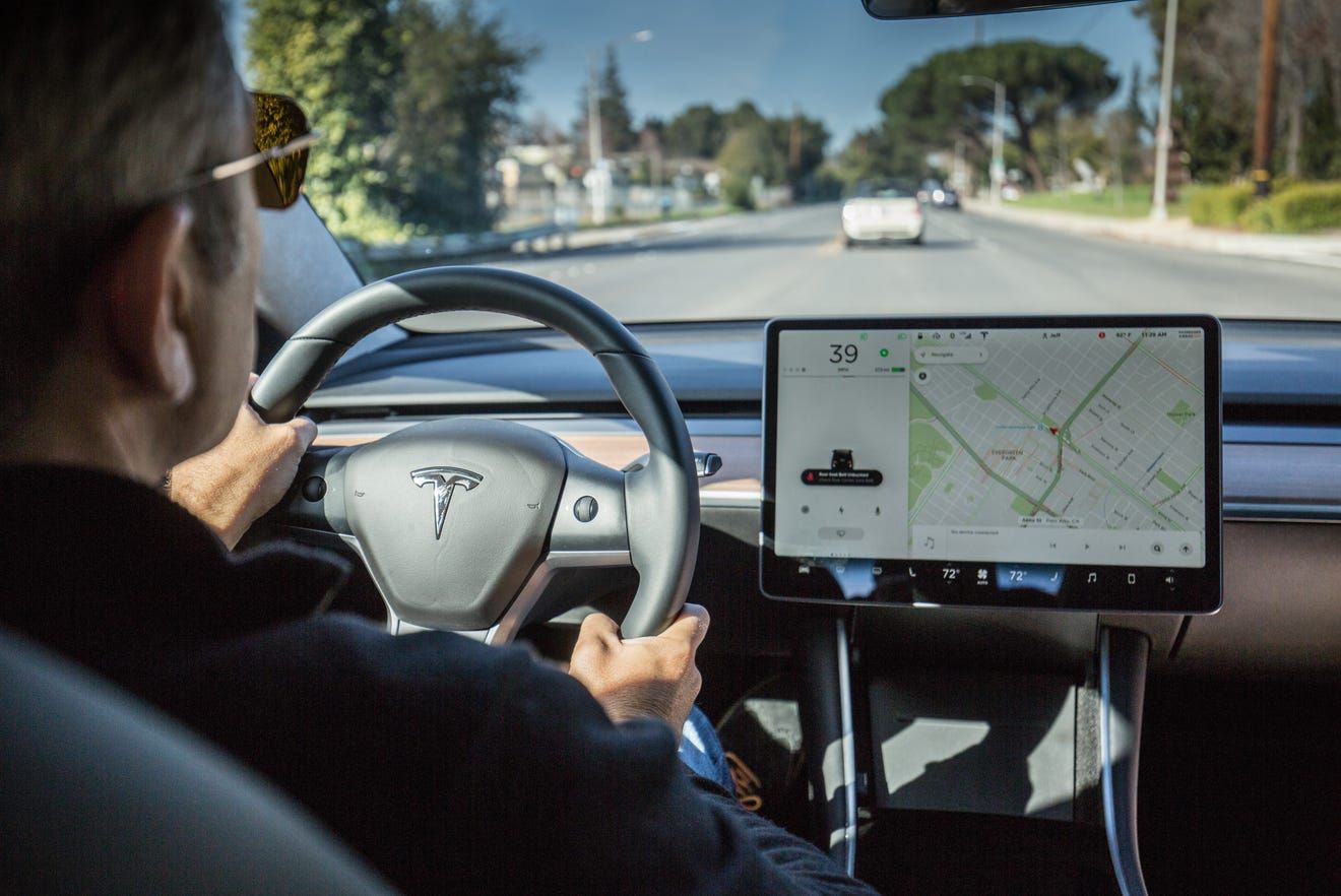 The interior of a car with a sole digital screen