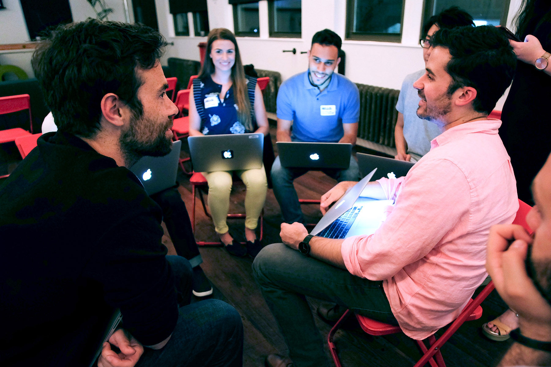 Several people in a circle, chatting