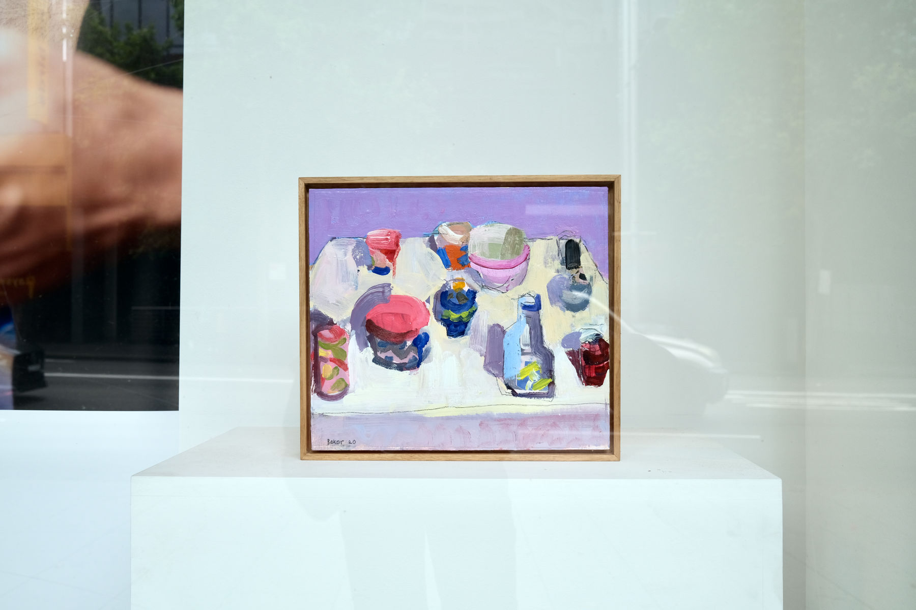 An empty art exhibition with paintings on the wall