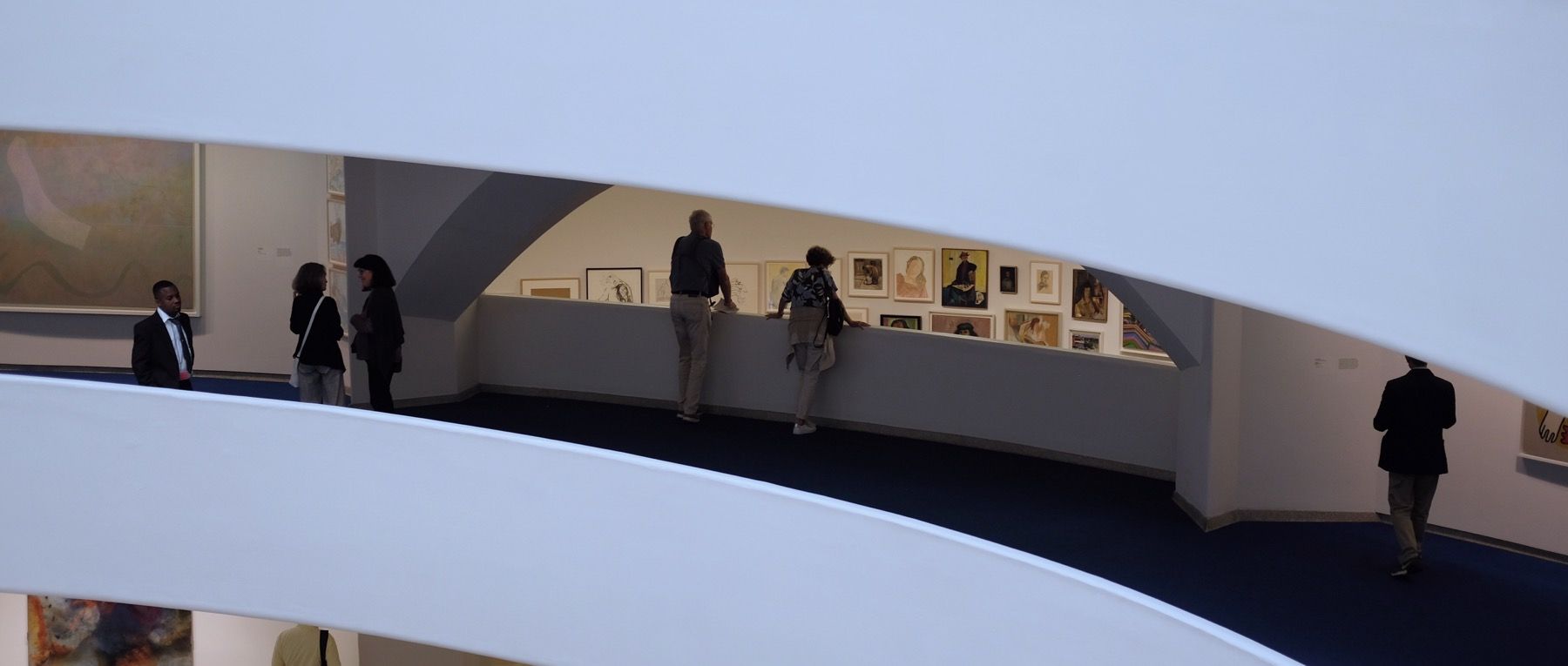 An older couple investigated some art